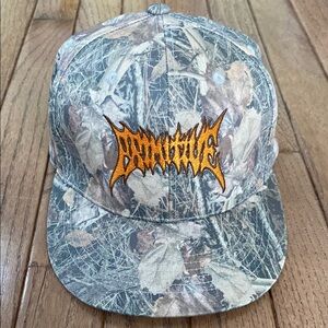 Primitive Tree Camo Snapback Hat with Orange Primitive Logo